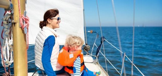 mom and her child seating on the boat